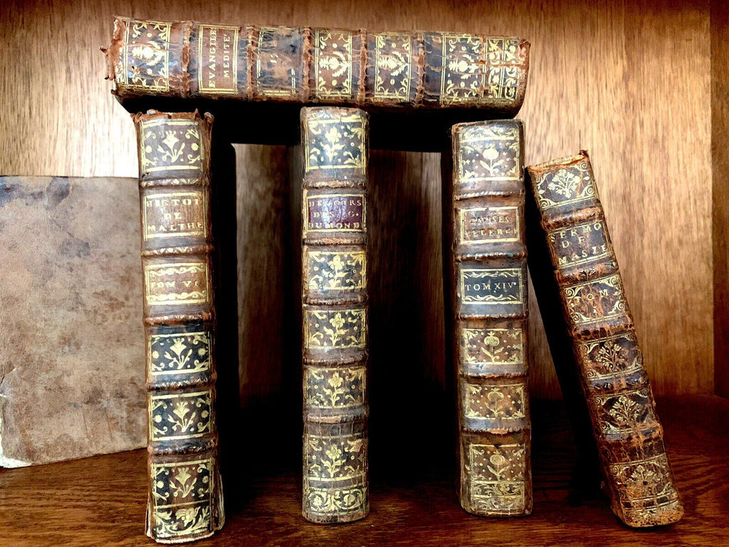 Collection of antique leather-bound books from the 1700s