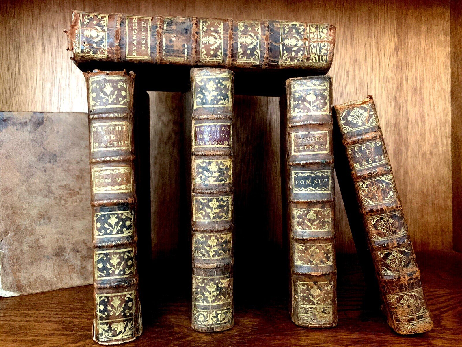 Collection of antique leather-bound books from the 1700s